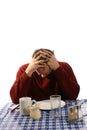 Upset man at diner with hands in mussed hair Royalty Free Stock Photo