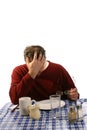 Upset man at diner with head in hand