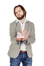 Upset man holding gift box, displeased with what he received, di Royalty Free Stock Photo