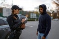 Upset man and police woman issuing fine