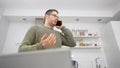 Upset man talking on the mobile phone. Royalty Free Stock Photo