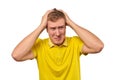 Upset young male in yellow T-shirt clutched at head, forgetful man, isolated on white background Royalty Free Stock Photo