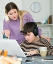 Upset mother arguing with son who plaing video games Royalty Free Stock Photo
