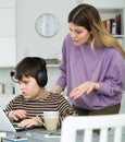 Upset mother arguing with son who plaing video games Royalty Free Stock Photo