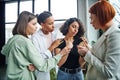 upset multiracial woman standing with closed