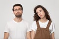 Upset not concentrated exhausted millennial couple feeling bored.