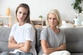 Upset older mother and adult daughter not talking after fight Royalty Free Stock Photo