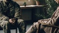 Upset pensive military soldier having therapy session with psychologist in office,suffering mental illness or posttraumatic stress