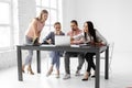 Upset people from a business group. Saddened by poor work employees sitting at the table in a meeting in the office Royalty Free Stock Photo