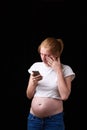 Pregnancy, motherhood, technology, people and expectation concept - sad pregnant woman calling on smartphone at home Royalty Free Stock Photo