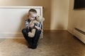 Upset problem child close to the staircase concept for bullying, depression stress Royalty Free Stock Photo
