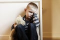 Upset problem child close to the staircase concept for bullying, depression stress