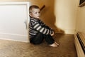 Upset problem child close to the staircase concept for bullying, depression stress Royalty Free Stock Photo