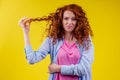 Upset redhaired ginger foxy woman with dryness tangled red hair