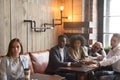 Upset rejected girl ignoring people cheering her in cafe Royalty Free Stock Photo