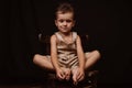 upset sad boy crying sitting on a wooden chair Royalty Free Stock Photo