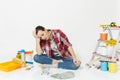 Upset sad woman holds bundle of cash money, supermarket grocery push cart for shopping. Instruments for renovation