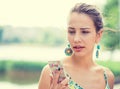 Upset sad woman talking texting on phone displeased