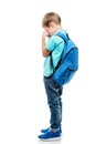 Upset schoolboy with backpack crying on white background