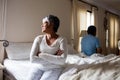 Upset senior couple ignoring each other in bedroom Royalty Free Stock Photo