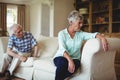 Upset senior couple relaxing on sofa Royalty Free Stock Photo