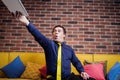 Upset stressed, angry business man throwing his digital tablet,Upset stressed, Carefree businessman throwing up his tablet in Royalty Free Stock Photo