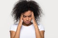 Upset stressed black woman massaging temples feeling pain terrible migraine Royalty Free Stock Photo
