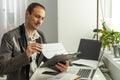 Upset stressed worried caucasian male stock investor, broker, financial expert, sit at work desk in front of computer Royalty Free Stock Photo