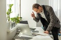 Upset stressed worried caucasian male stock investor, broker, financial expert, sit at work desk in front of computer Royalty Free Stock Photo