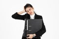 Upset stressed young Asian business woman in suit suffering from severe depression over white isolated background. Failure and Royalty Free Stock Photo