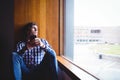 Upset student looking through window