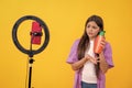 upset teen girl beauty blogger isolated on yellow. teen girl beauty blogger in studio. Royalty Free Stock Photo
