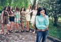 Upset teenage girl with friends gossiping