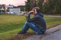 Upset teenager sitting on the ground.