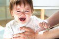 Upset toddler boy crying in his house Royalty Free Stock Photo