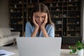 Upset unhappy employee tired of work at computer, feeling headache Royalty Free Stock Photo