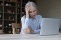 Upset unhappy mature business lady thinking over bad news Royalty Free Stock Photo