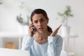 Upset unpleasantly surprised woman making phone call Royalty Free Stock Photo