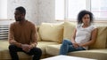 Upset wife feeling guilty after quarrel with African American husband.