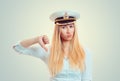 Upset woman in captain hat showing thumb down Royalty Free Stock Photo