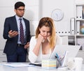 Upset woman with disgruntled boss Royalty Free Stock Photo