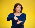 Upset woman gesturing pay me my money back, finger on palm gestu Royalty Free Stock Photo