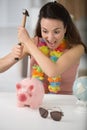 upset woman has to break piggy bank Royalty Free Stock Photo