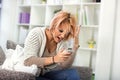 Upset woman looking at mobile phone Royalty Free Stock Photo