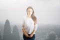 Upset woman in misty city Royalty Free Stock Photo