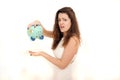 Upset woman with a piggy bank