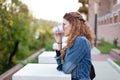 Upset woman planning revenge while drinking in park