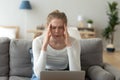 Upset woman suffering from headache, touching temples, feeling pain Royalty Free Stock Photo