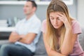 Upset woman thinking on couch after fight with husband Royalty Free Stock Photo