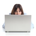 Upset woman watching a laptop